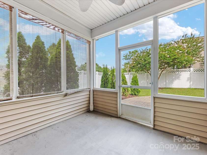 8603 Robinson Meadow Court, Charlotte, NC 28277.  MLS# CAR4265734, YatesRealty ID 19593. The screened porch overlooks the gorgoeus green, corner, private, fenced lot!