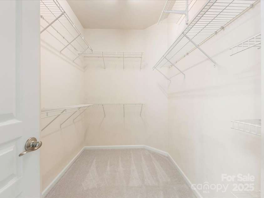 8603 Robinson Meadow Court, Charlotte, NC 28277.  MLS# CAR4265734, YatesRealty ID 19593. Walk-in closet in the primary suite.