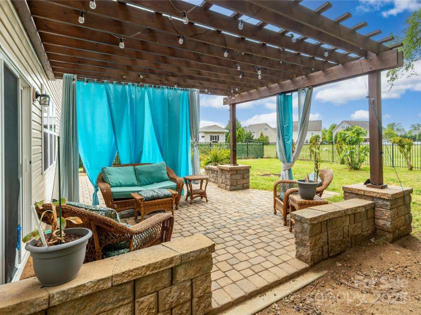 4924 Riverdale Drive, Charlotte, NC 28273.  MLS# CAR4241747, YatesRealty ID 19595. Extended Paver Patio w/ Pergola