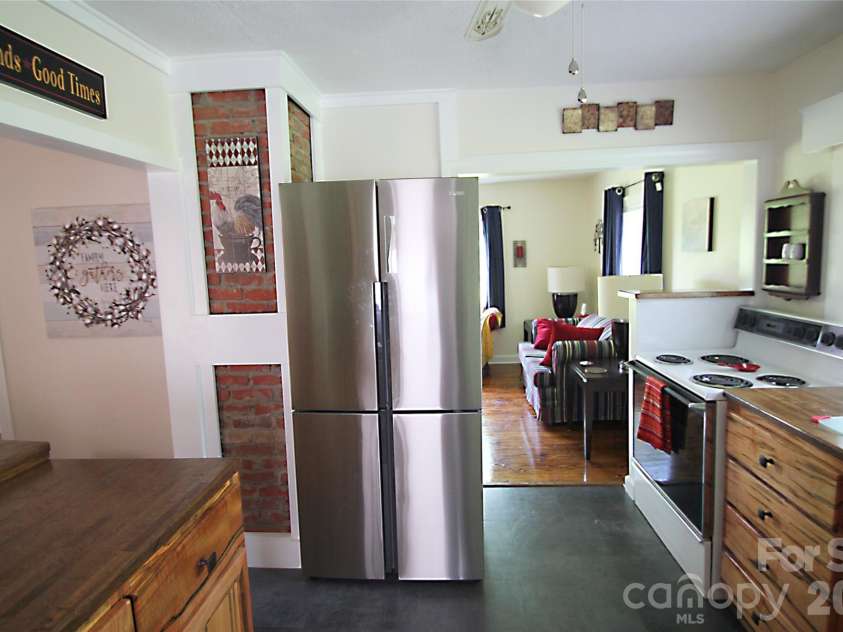 144 Macedonia Road, Asheville, NC 28804.  MLS# CAR4371686, YatesRealty ID 19598. Kitchen - Haier full-sized SS refrigerator