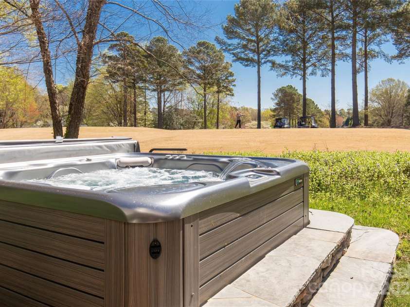 22 Honeysuckle Lane, Clover, SC 29710.  MLS# CAR4266746, YatesRealty ID 19603. Hot Tub facing golf course