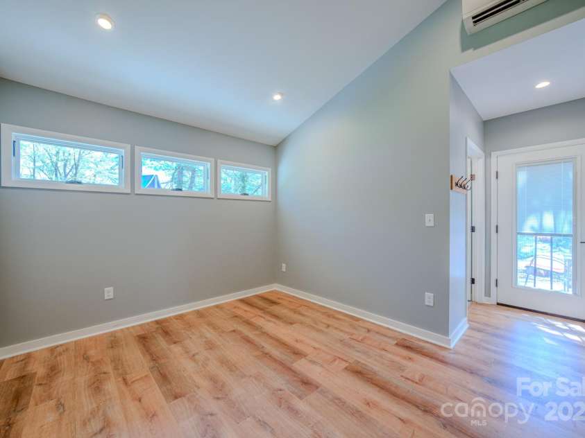 10 Clearbrook Road, Asheville, NC 28805.  MLS# CAR4238252, YatesRealty ID 19609. Bedroom in suite with lots of light and privacy.