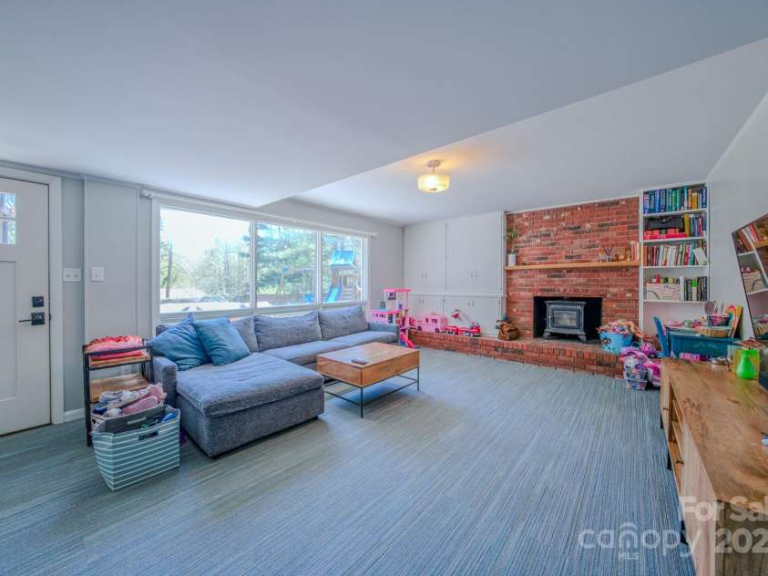 10 Clearbrook Road, Asheville, NC 28805.  MLS# CAR4238252, YatesRealty ID 19609. Lower level family room. Light and colorful.