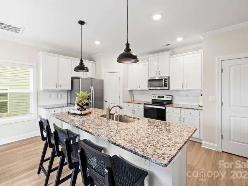 159 Tanner Loop, Troutman, NC 28166.  MLS# CAR4196119, YatesRealty ID 1961. Kitchen with nice size island