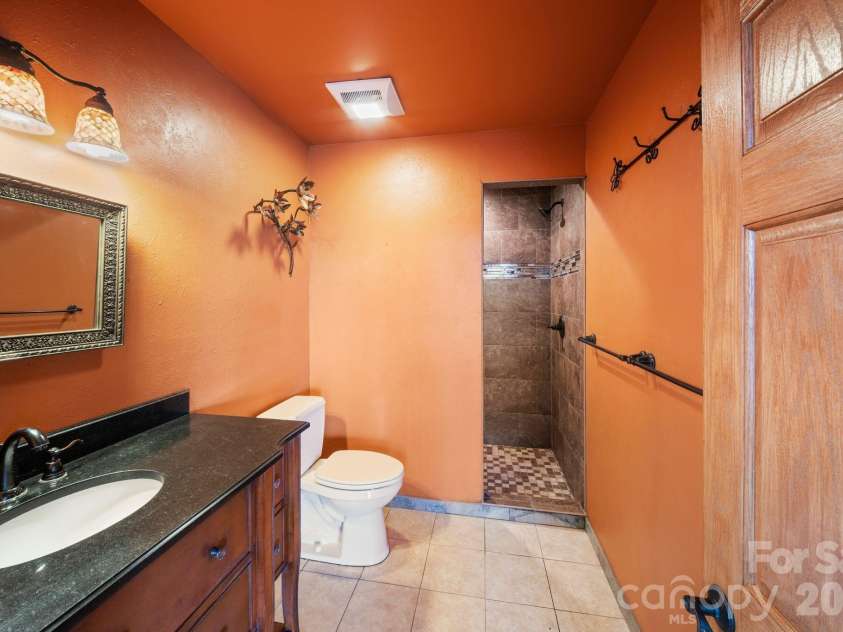 98 Scarlett Drive, Pisgah Forest, NC 28768.  MLS# CAR4360950, YatesRealty ID 19613. Full bathroom 6 located by pool/spa