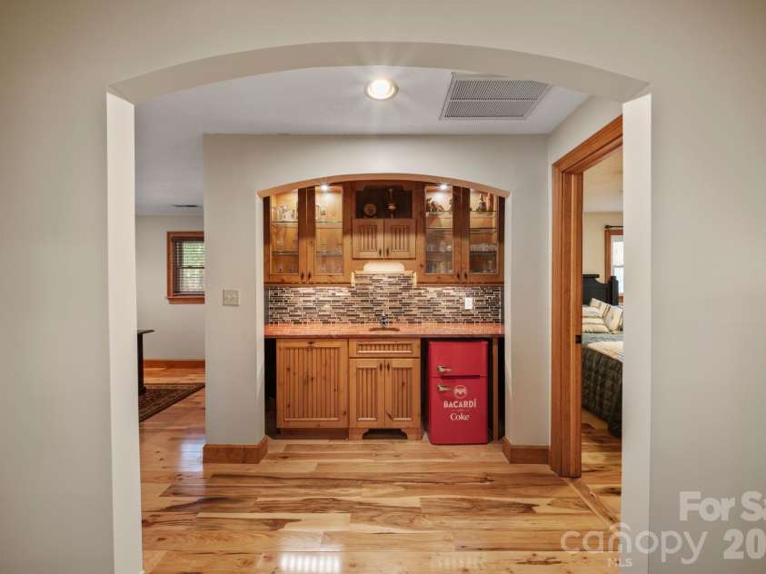 98 Scarlett Drive, Pisgah Forest, NC 28768.  MLS# CAR4360950, YatesRealty ID 19613. Main level wet bar 