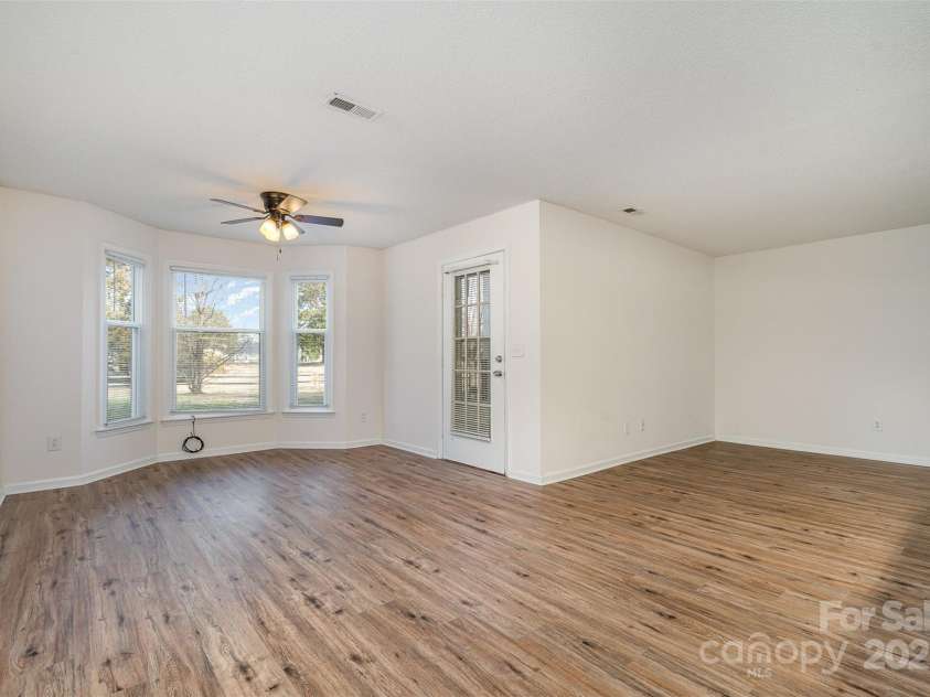 10240 Rose Meadow Lane, Charlotte, NC 28277.  MLS# CAR4213685, YatesRealty ID 19614. Living area with an open floor plan immersed with natural light