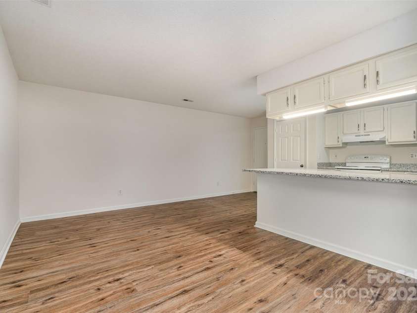 10240 Rose Meadow Lane, Charlotte, NC 28277.  MLS# CAR4213685, YatesRealty ID 19614. Open Floor Plan transitions from dining area to the living area with kitchen/ breakfast bar nicely located