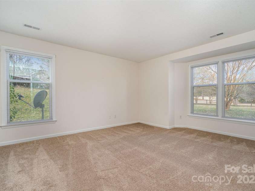 10240 Rose Meadow Lane, Charlotte, NC 28277.  MLS# CAR4213685, YatesRealty ID 19614. Primary Bedroom with natural light and fresh carpet