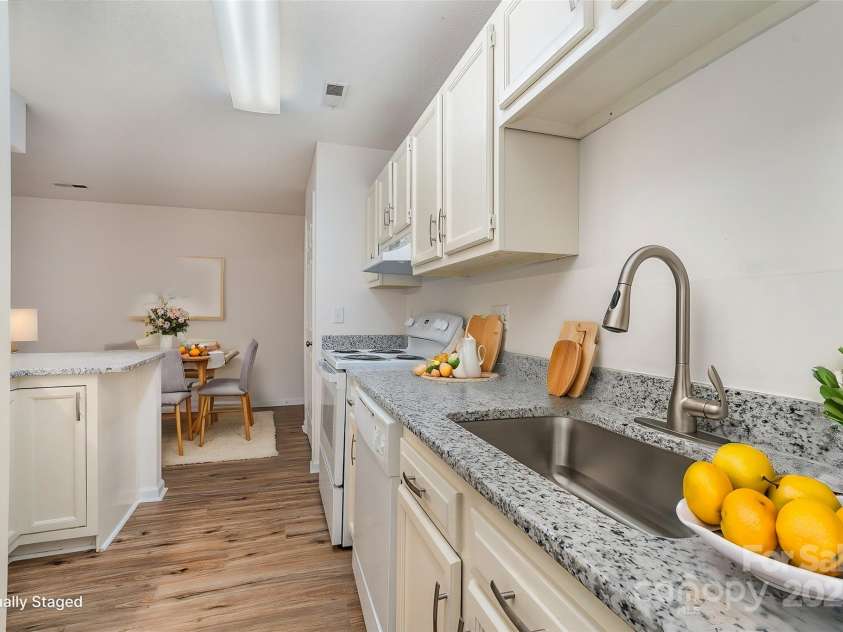 10240 Rose Meadow Lane, Charlotte, NC 28277.  MLS# CAR4213685, YatesRealty ID 19614. Virtually Staged Kitchen with a view to the dining area