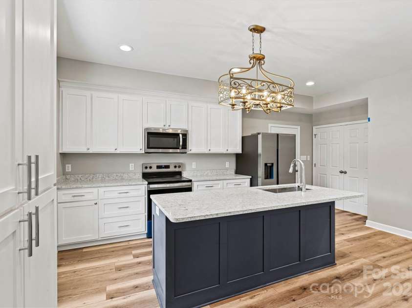 102 Kerda Street, Taylorsville, NC 28681.  MLS# CAR4244312, YatesRealty ID 19617. Quartz Island Kitchen View