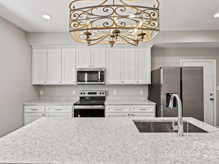 102 Kerda Street, Taylorsville, NC 28681.  MLS# CAR4244312, YatesRealty ID 19617. Quartz Island/Kitchen View