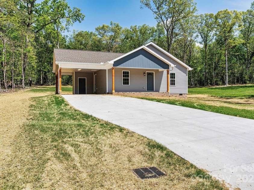 102 Kerda Street, Taylorsville, NC 28681.  MLS# CAR4244312, YatesRealty ID 19617. Side Yard/Drive View