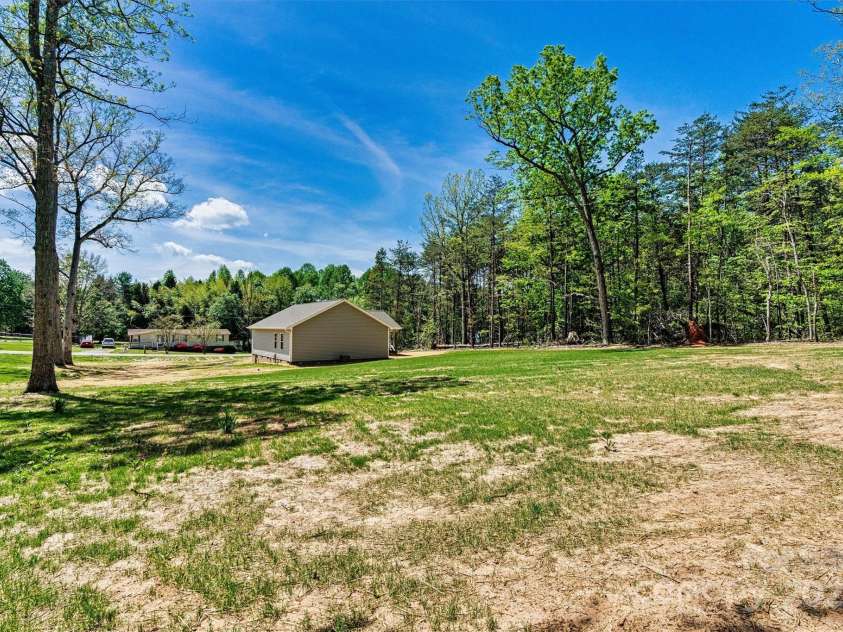 102 Kerda Street, Taylorsville, NC 28681.  MLS# CAR4244312, YatesRealty ID 19617. Spacious Side and Back Yard View