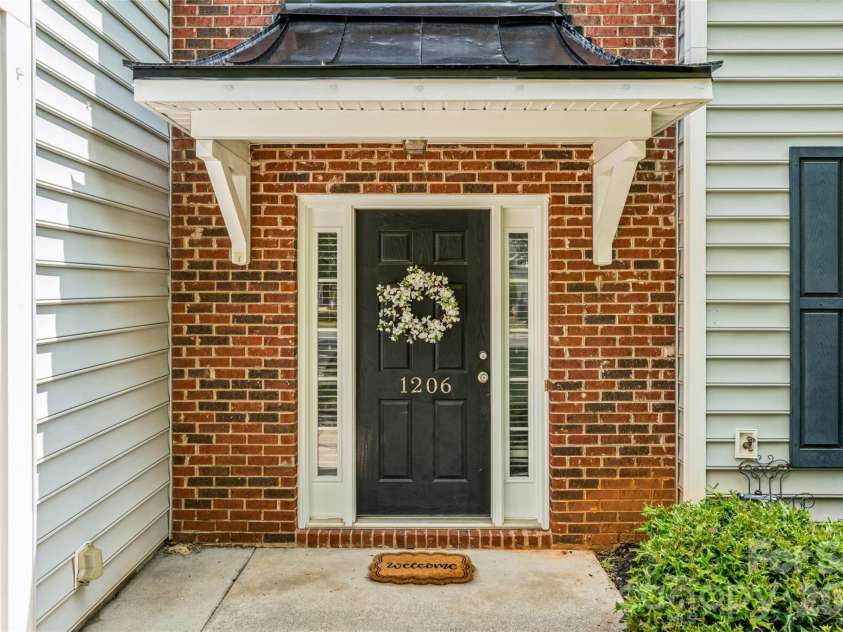1206 Arrow Lake Court, Fort Mill, SC 29707.  MLS# CAR4371326, YatesRealty ID 19622. Covered front porch 