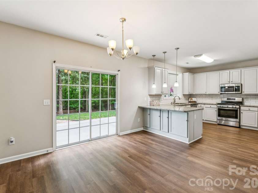 1206 Arrow Lake Court, Fort Mill, SC 29707.  MLS# CAR4371326, YatesRealty ID 19622. Dining area and kitchen
