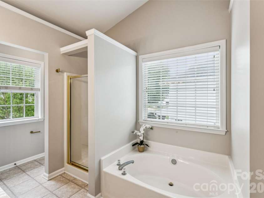 1206 Arrow Lake Court, Fort Mill, SC 29707.  MLS# CAR4371326, YatesRealty ID 19622. Primary bathroom with shower and soaker tub