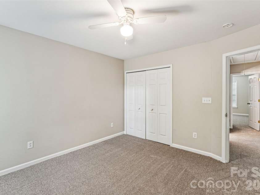 1206 Arrow Lake Court, Fort Mill, SC 29707.  MLS# CAR4371326, YatesRealty ID 19622. Secondary bedroom with backyard view