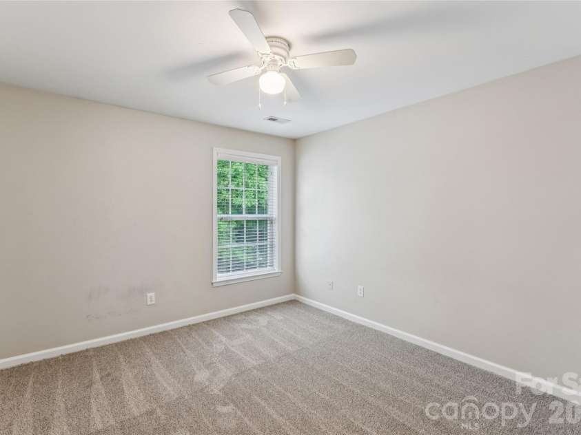 1206 Arrow Lake Court, Fort Mill, SC 29707.  MLS# CAR4371326, YatesRealty ID 19622. Secondary bedroom with backyard view