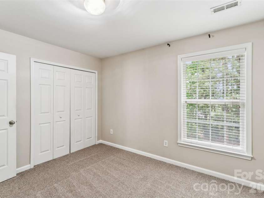 1206 Arrow Lake Court, Fort Mill, SC 29707.  MLS# CAR4371326, YatesRealty ID 19622. Secondary bedroom with backyard view