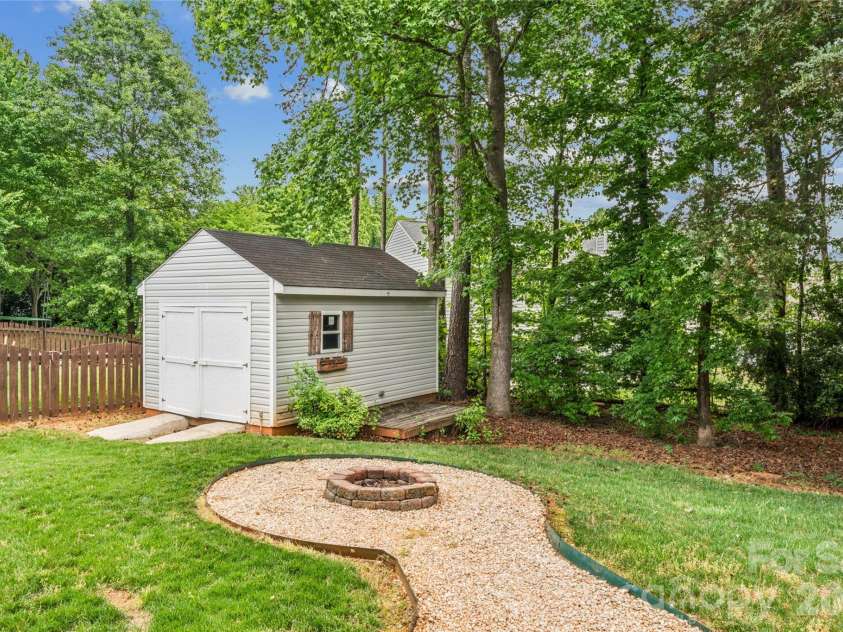1206 Arrow Lake Court, Fort Mill, SC 29707.  MLS# CAR4371326, YatesRealty ID 19622. Shed and firepit