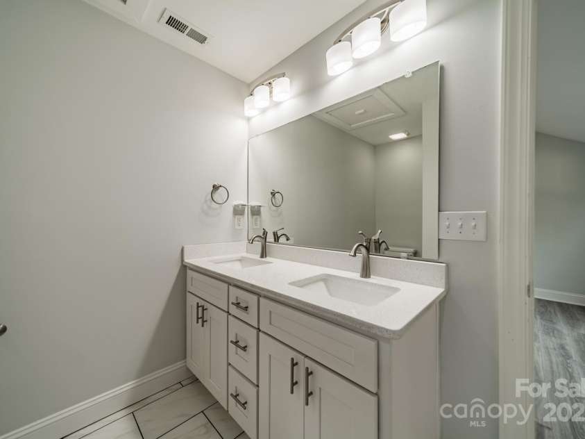7901 Reames Road, Charlotte, NC 28216.  MLS# CAR4261222, YatesRealty ID 19628. Primary bathroom