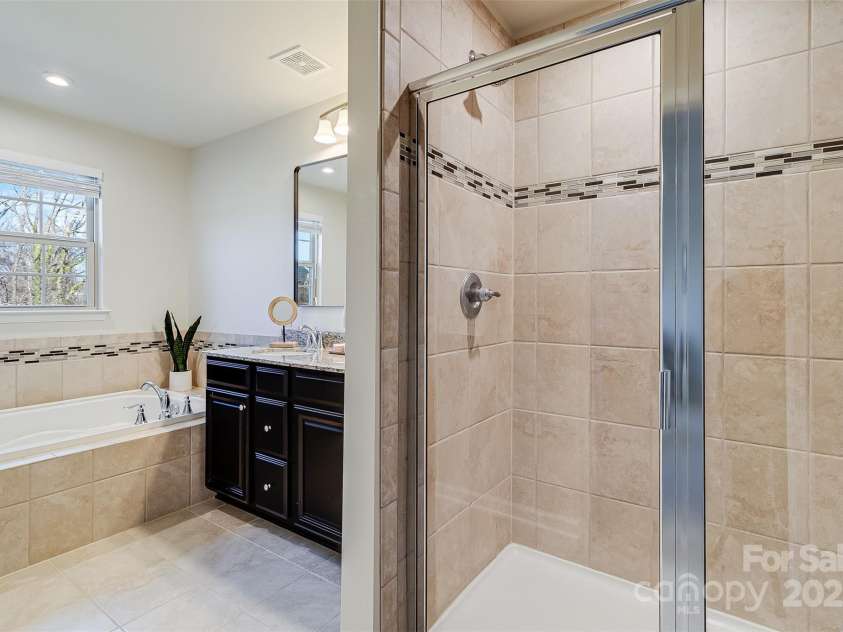 3108 Major Samuals Way, Charlotte, NC 28208.  MLS# CAR4334043, YatesRealty ID 1963. Primary bathroom with large separate shower, tiled to ceiling.