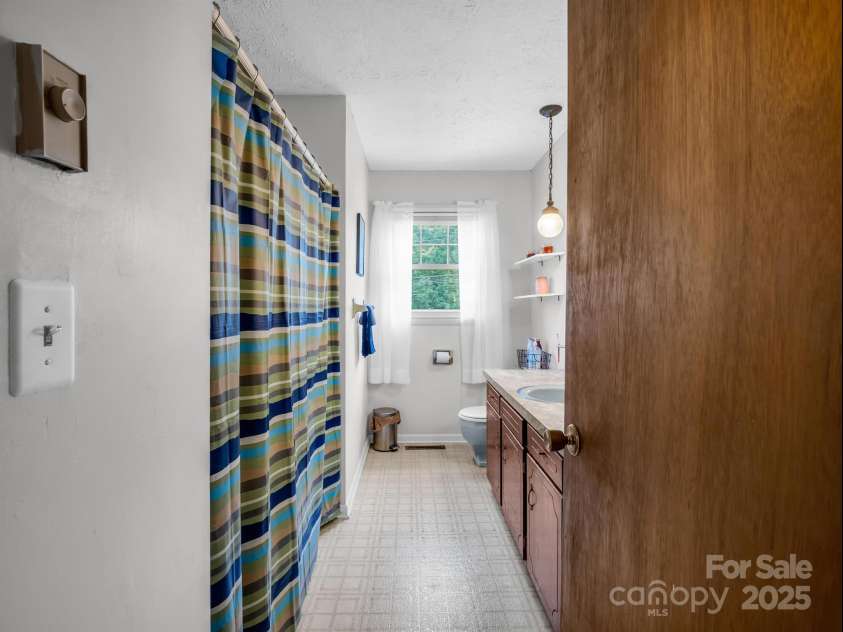 2512 Brevard Road, Hendersonville, NC 28791.  MLS# CAR4237635, YatesRealty ID 19632. Hall bath