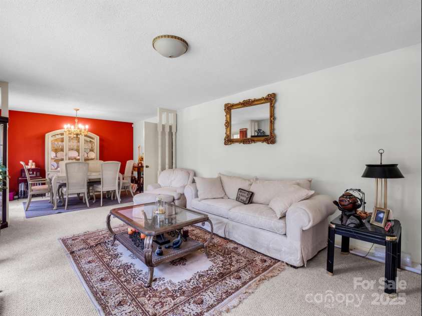 2512 Brevard Road, Hendersonville, NC 28791.  MLS# CAR4237635, YatesRealty ID 19632. Living room open to dining room