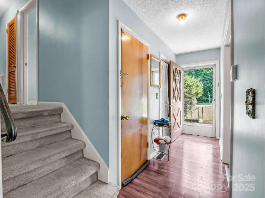 2512 Brevard Road, Hendersonville, NC 28791.  MLS# CAR4237635, YatesRealty ID 19632. Steps to upper bedroom level