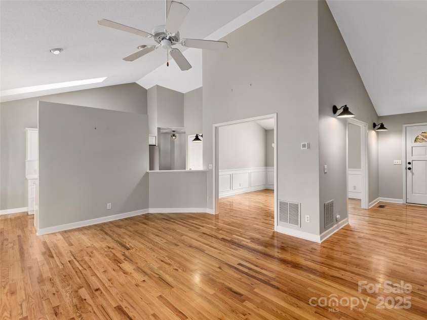 9 Kit Court, Fletcher, NC 28732.  MLS# CAR4246263, YatesRealty ID 19633. Living Room looking into Dining Room