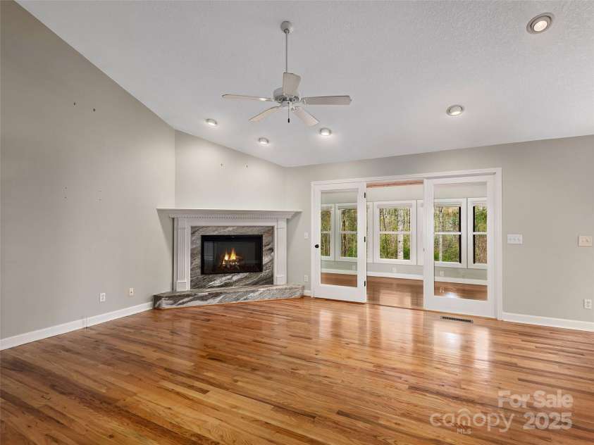 9 Kit Court, Fletcher, NC 28732.  MLS# CAR4246263, YatesRealty ID 19633. Living Room looking into Sun Room