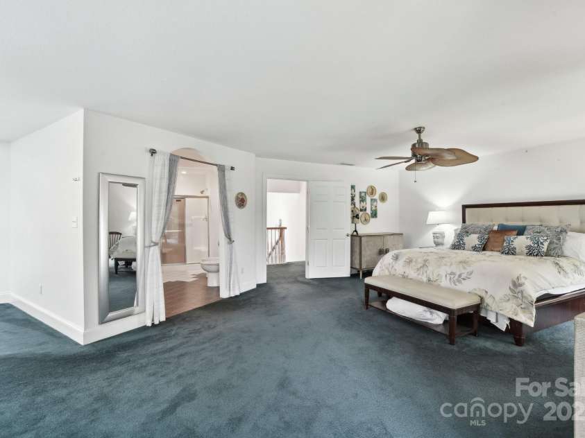 142 Justice Street, Fletcher, NC 28732.  MLS# CAR4234693, YatesRealty ID 19634. A mix of beautiful carpet and tile throughout the upper level