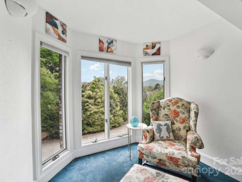 142 Justice Street, Fletcher, NC 28732.  MLS# CAR4234693, YatesRealty ID 19634. A sunny reading nook to relax or take in the views