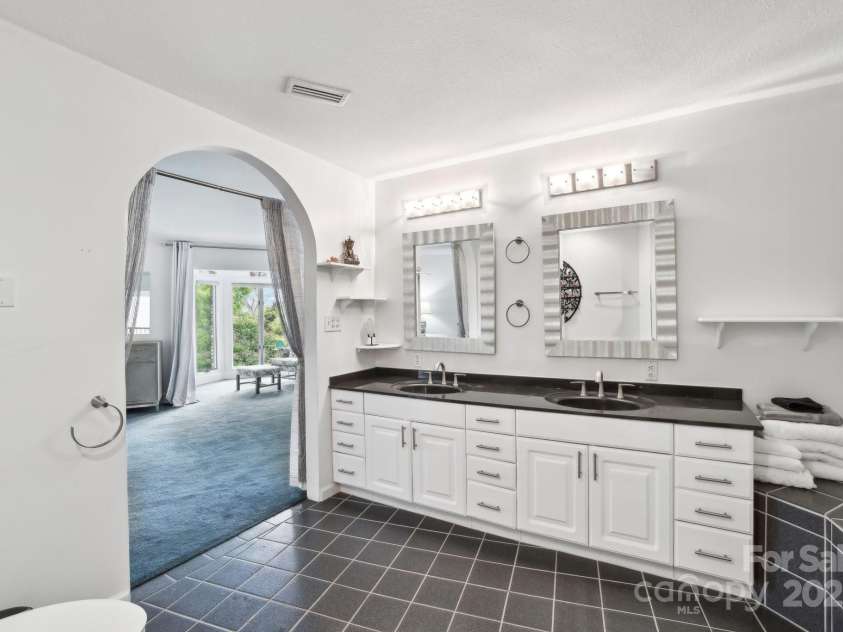 142 Justice Street, Fletcher, NC 28732.  MLS# CAR4234693, YatesRealty ID 19634. Beautiful architecture flows throughout the primary bedroom and bathroom