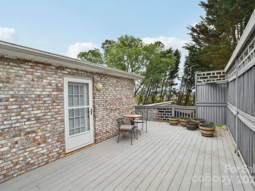 142 Justice Street, Fletcher, NC 28732.  MLS# CAR4234693, YatesRealty ID 19634. Endless entertaining options on this spacious and private deck
