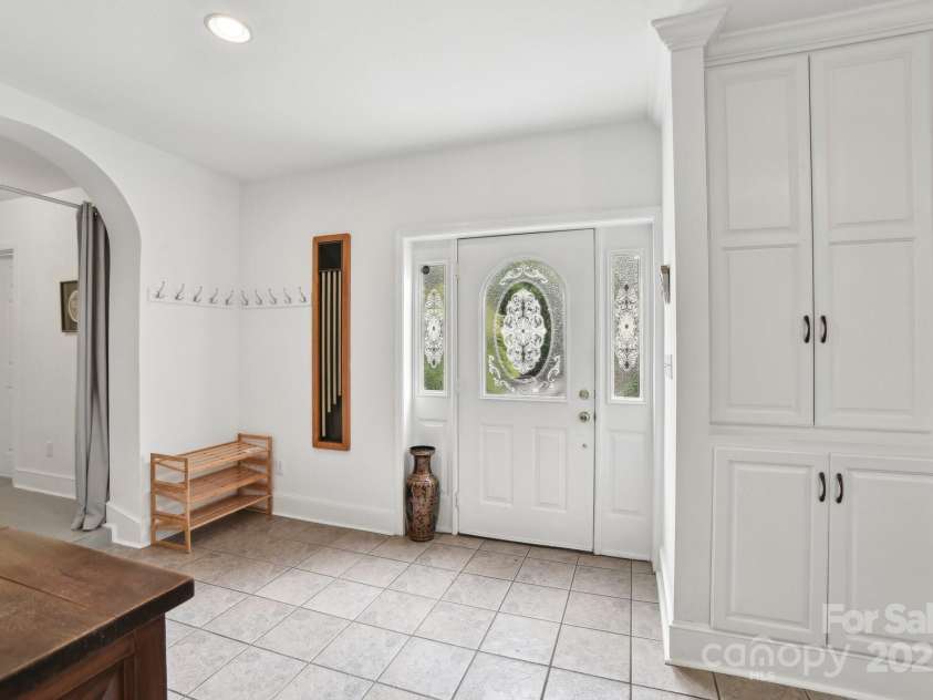 142 Justice Street, Fletcher, NC 28732.  MLS# CAR4234693, YatesRealty ID 19634. Entryway is filled with natural light and warmth