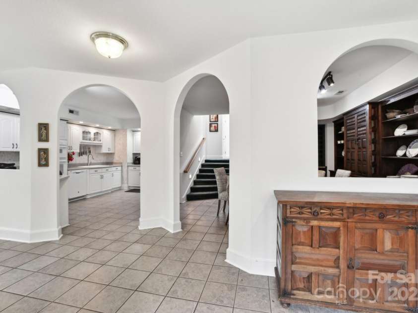 142 Justice Street, Fletcher, NC 28732.  MLS# CAR4234693, YatesRealty ID 19634. Inviting living room showcases soaring cathedral ceilings and skylights