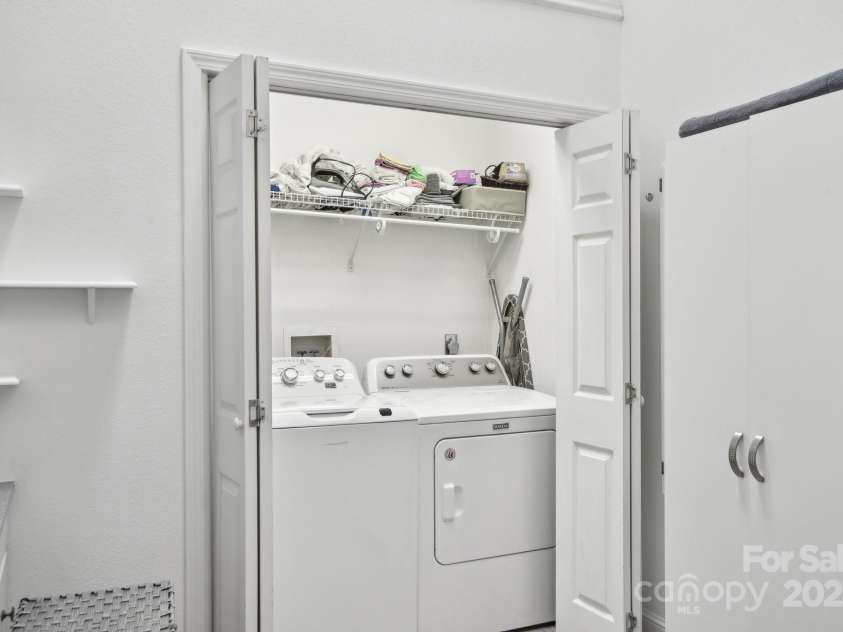 142 Justice Street, Fletcher, NC 28732.  MLS# CAR4234693, YatesRealty ID 19634. Laundry closet with shelving space