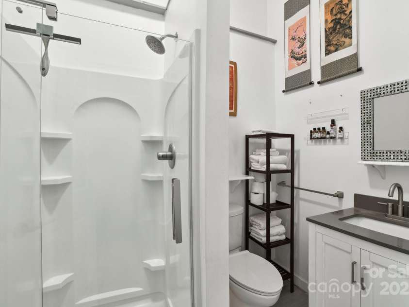 142 Justice Street, Fletcher, NC 28732.  MLS# CAR4234693, YatesRealty ID 19634. Luxurious bath with modern style