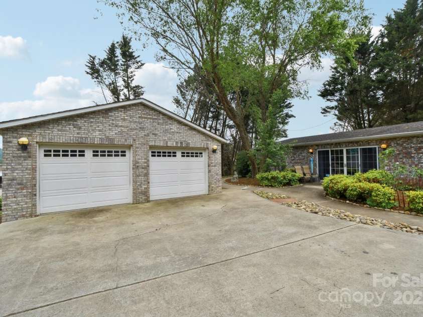 142 Justice Street, Fletcher, NC 28732.  MLS# CAR4234693, YatesRealty ID 19634. Plenty of space for to accommodate tools and vehicles