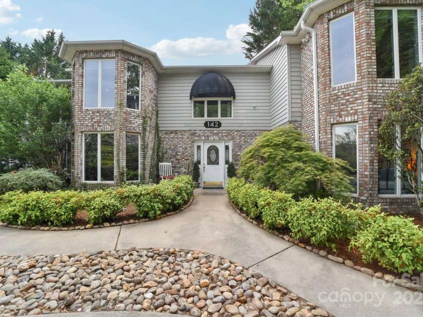 142 Justice Street, Fletcher, NC 28732.  MLS# CAR4234693, YatesRealty ID 19634. Stunning modern residence nestled in the vibrant heart of Fletcher!