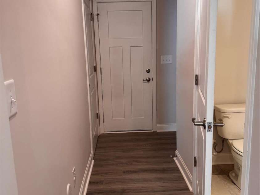 4041 Port Richmond Avenue, Gastonia, NC 28056.  MLS# CAR4258414, YatesRealty ID 19636. Hall leading to garage, drop zone, closet and half bath Representative Photo