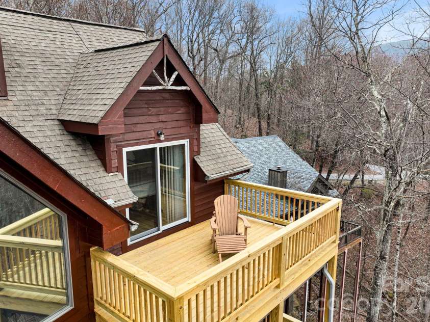 277 Kestrel Court, Sapphire, NC 28774.  MLS# CAR4362703, YatesRealty ID 19641. Upper deck off from bedroom.