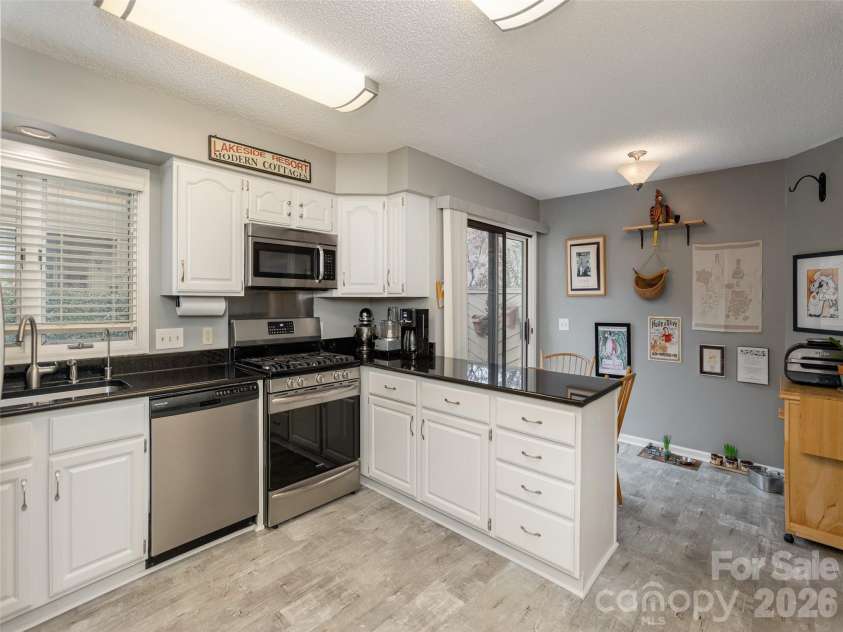 606 Red Oak Drive, Hendersonville, NC 28791.  MLS# CAR4317264, YatesRealty ID 19646. Kitchen bar with abundant storage and solid counter tops