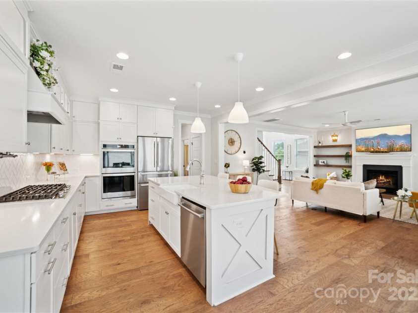528 Rock Skip Way, Fort Mill, SC 29708.  MLS# CAR4251109, YatesRealty ID 19657. Kitchen looking into living room and towards guest suite