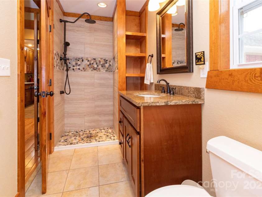15 Weaver Hill Road, Asheville, NC 28805.  MLS# CAR4217723, YatesRealty ID 1966. Primary en-suite bath shower