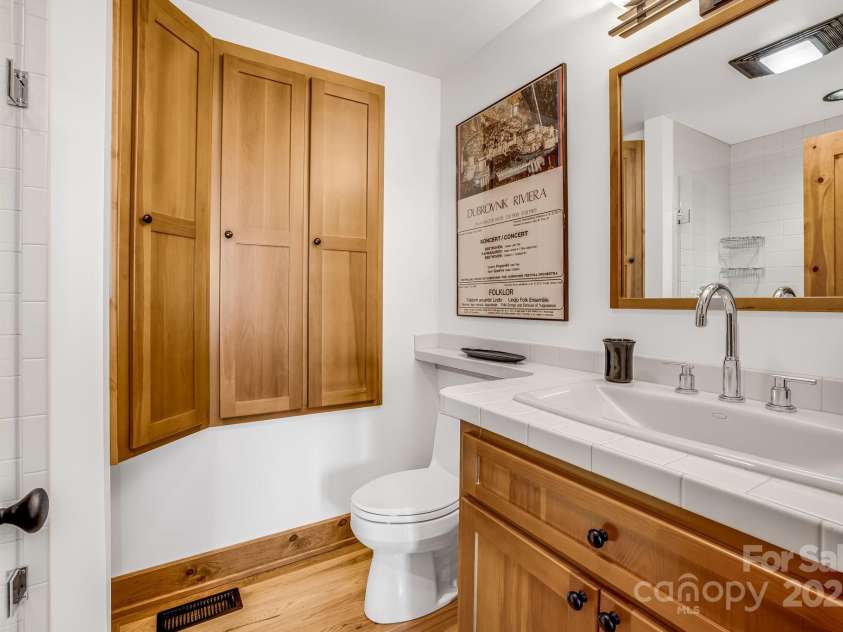 2399 El Miner Drive, Mars Hill, NC 28754.  MLS# CAR4259953, YatesRealty ID 19670. Full guest bathroom off the anteroom