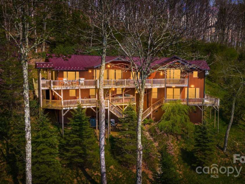 2399 El Miner Drive, Mars Hill, NC 28754.  MLS# CAR4259953, YatesRealty ID 19670. Set at 4,480 feet, this modern luxury mountain cabin offers cool summers and a front-row seat to nature's ever-changing show.