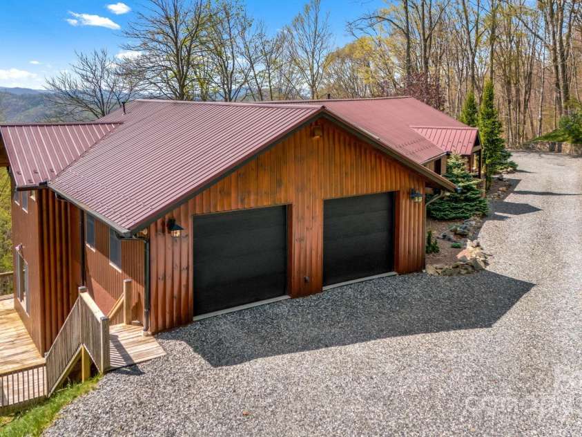 2399 El Miner Drive, Mars Hill, NC 28754.  MLS# CAR4259953, YatesRealty ID 19670. The level driveway provides easy access to the two-car garage, with plenty of extra parking for guests or outdoor gear.